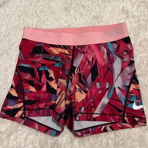 Pink and orange floral 3” Nike Pros, size: Medium